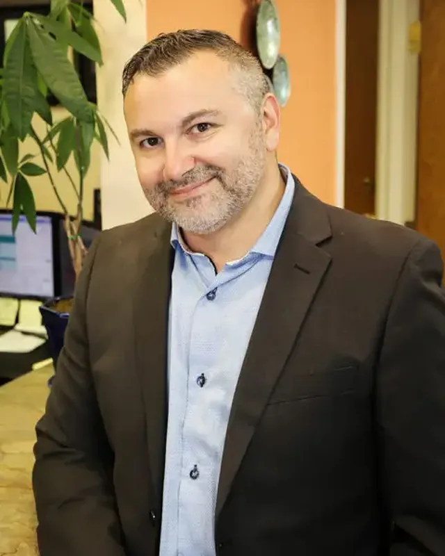 Jamey Kern, business manager at Munroe Chiropractic in Williamsville, NY